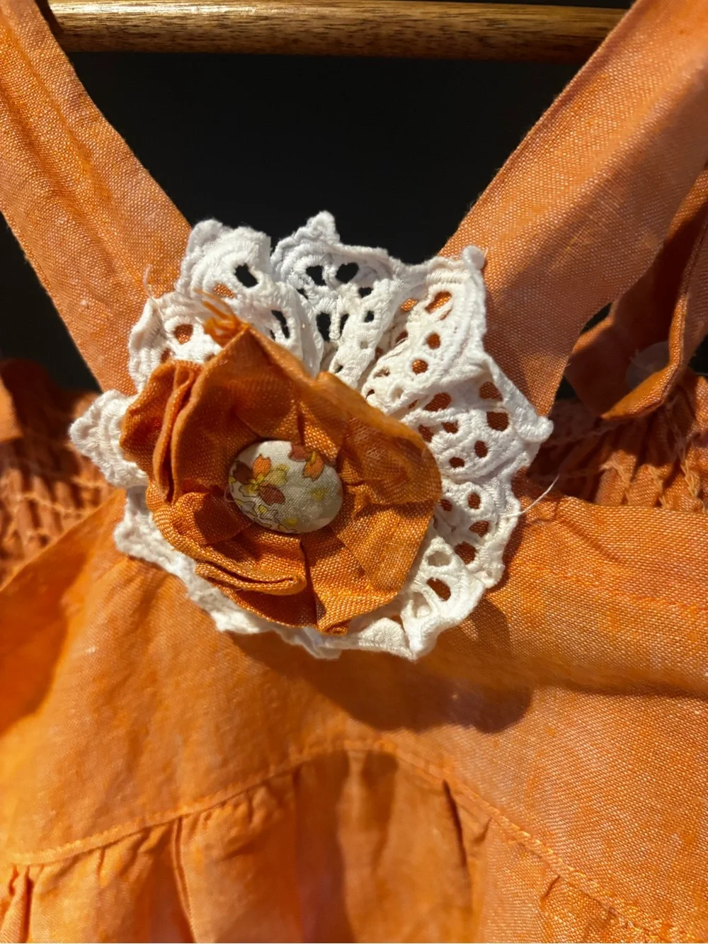 Classic Orange Crochet-Trim Romper with Floral Accent